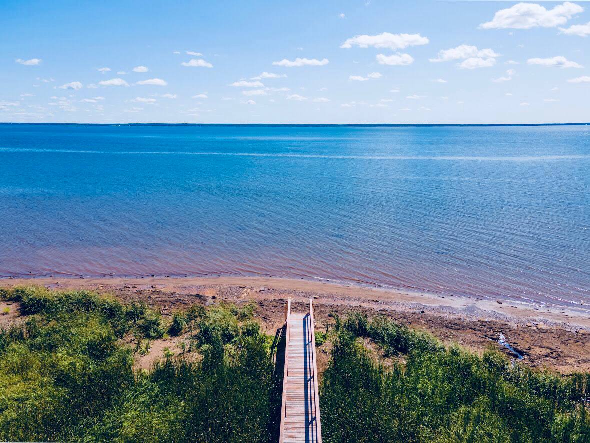 Aerial view of the boardwalk leading to the sandy beach and ocean