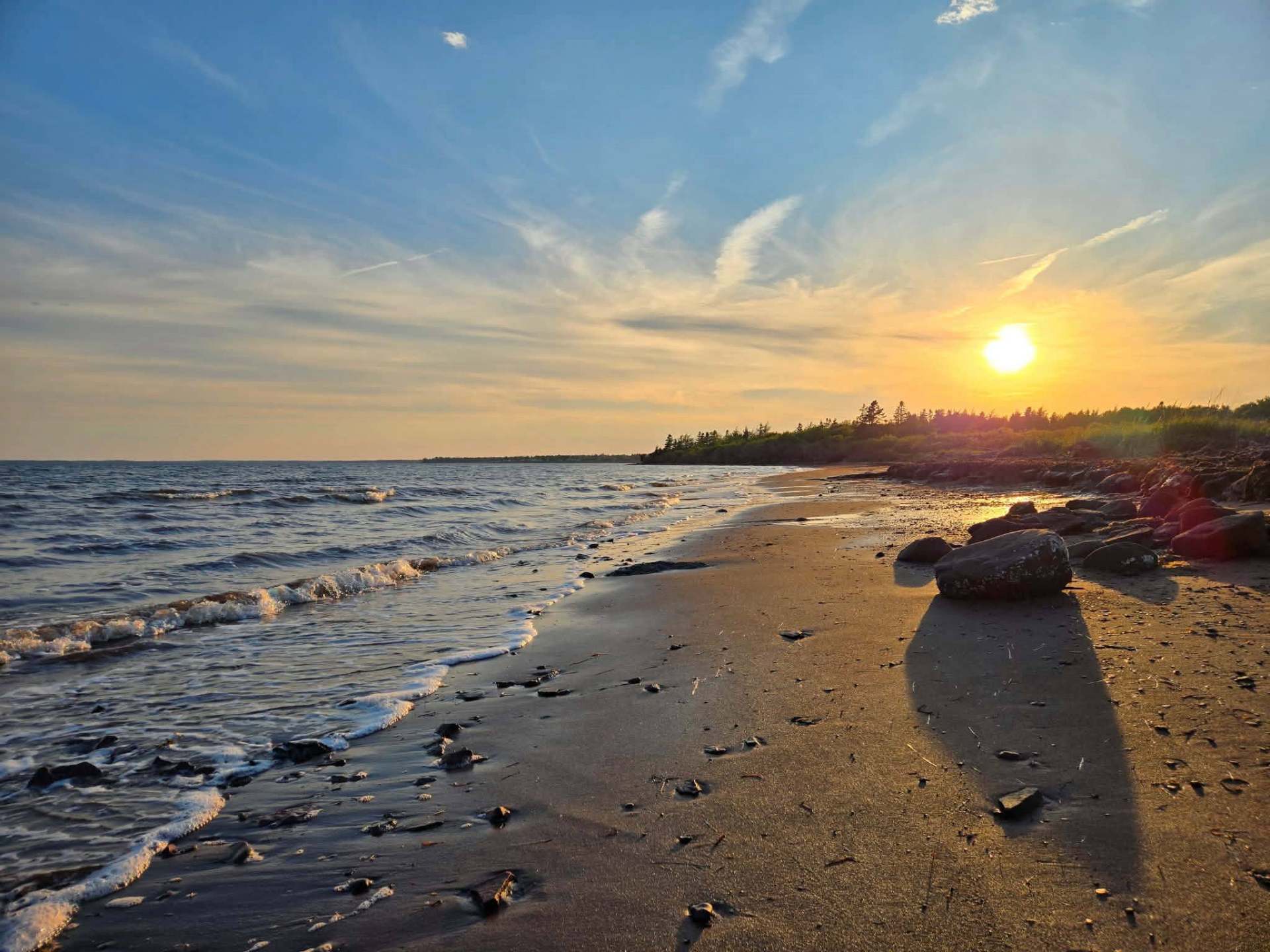 Sunset over the beach with rocks