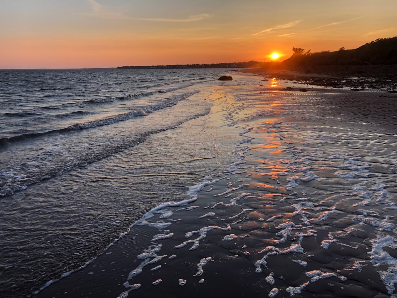 Golden sunset reflecting on ocean waves